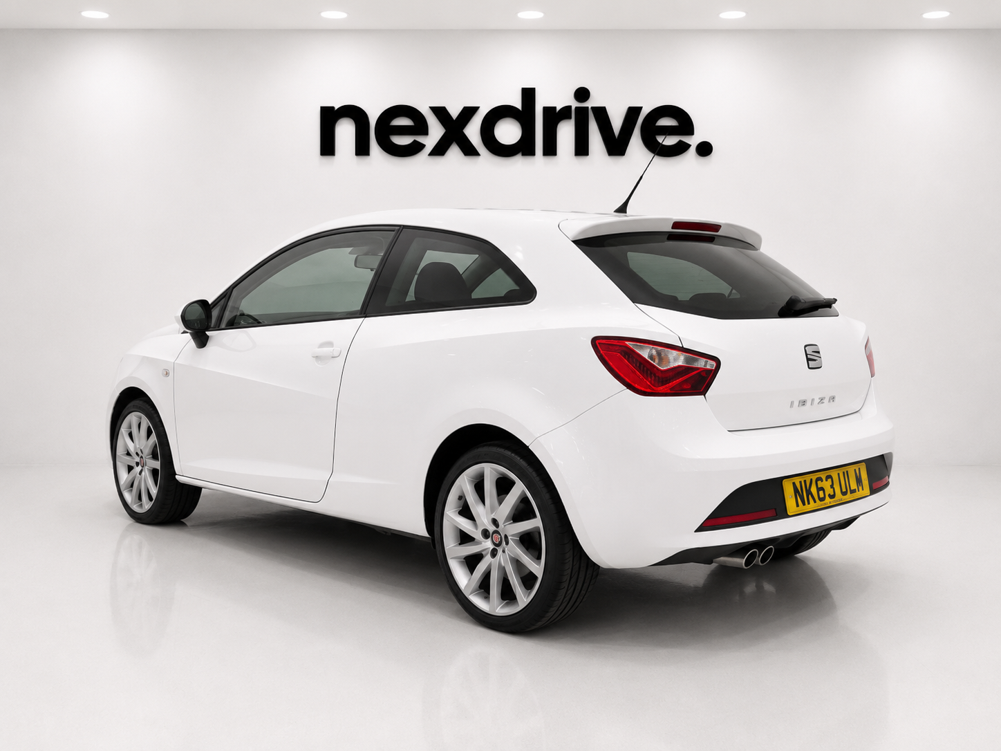 2013 SEAT Ibiza FR rear three quarter Ibiza badge